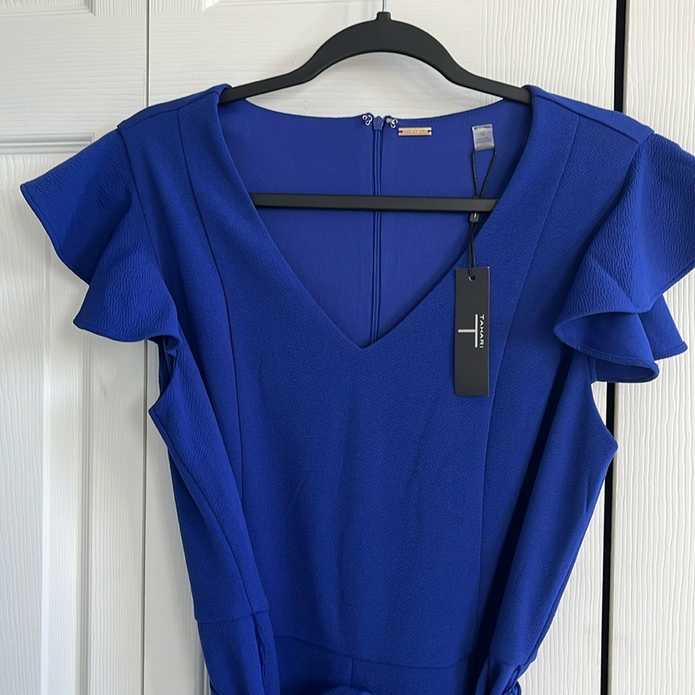 T Tahari size 12 jumpsuit with lovely ruffle sleeve and belt included.